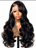 Signature Bounce raw Vietnamese layered bodywave wig on a mannequin, showing glossy black waves, face-framing layers and a sweeping side part.