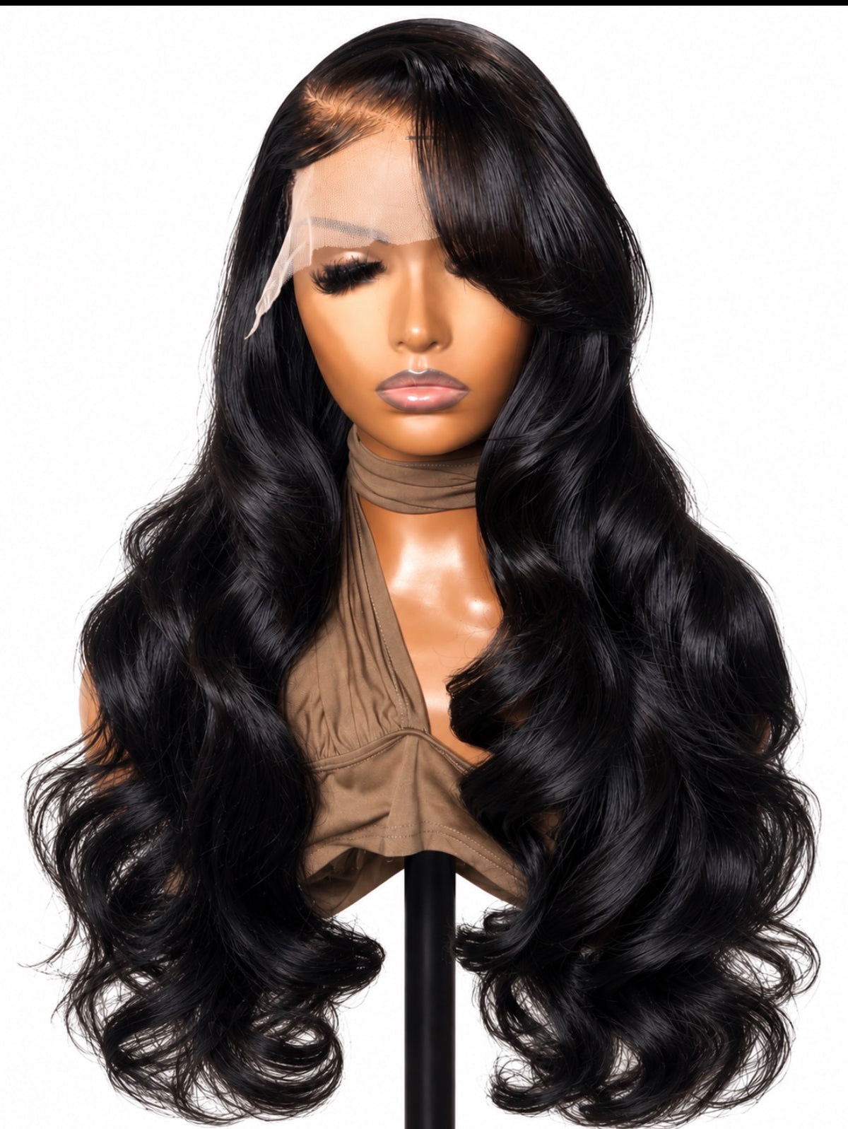Signature Bounce raw Vietnamese layered bodywave wig on a mannequin, showing glossy black waves, face-framing layers and a sweeping side part.